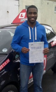 Driving test student with pass certificate